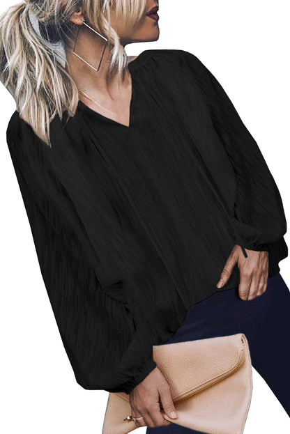 Haut uni texturé à col en V et manches lanternes 