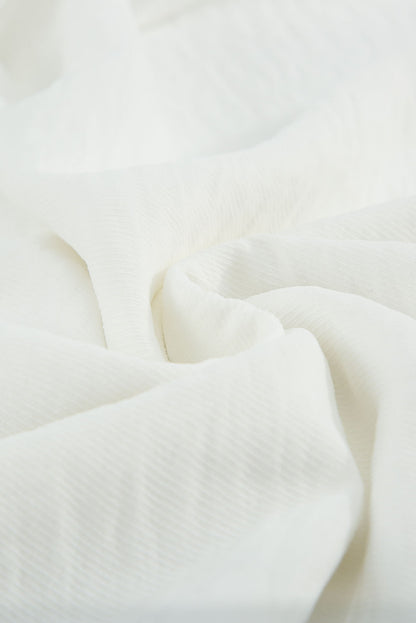 Top de manga corta con ojales de ganchillo