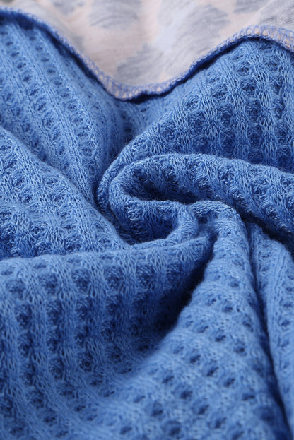 Top de punto con patchwork de leopardo colorblock