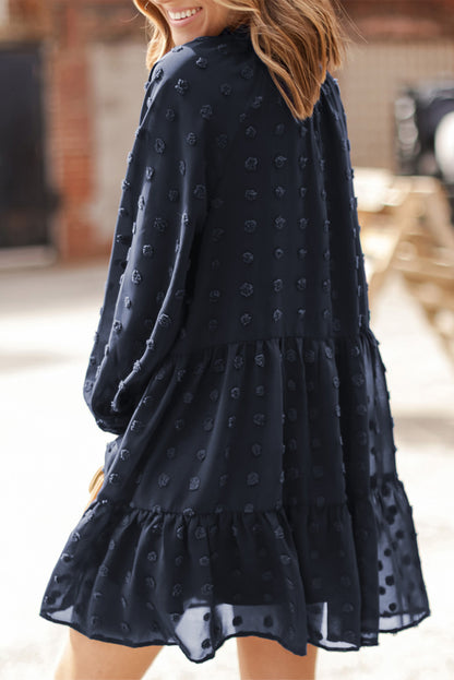 Mini-robe bleu foncé à manches longues bouffantes en maille à pois suisses