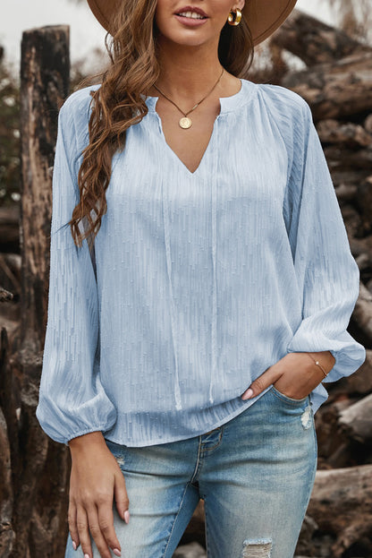 Haut uni texturé à col en V et manches lanternes 