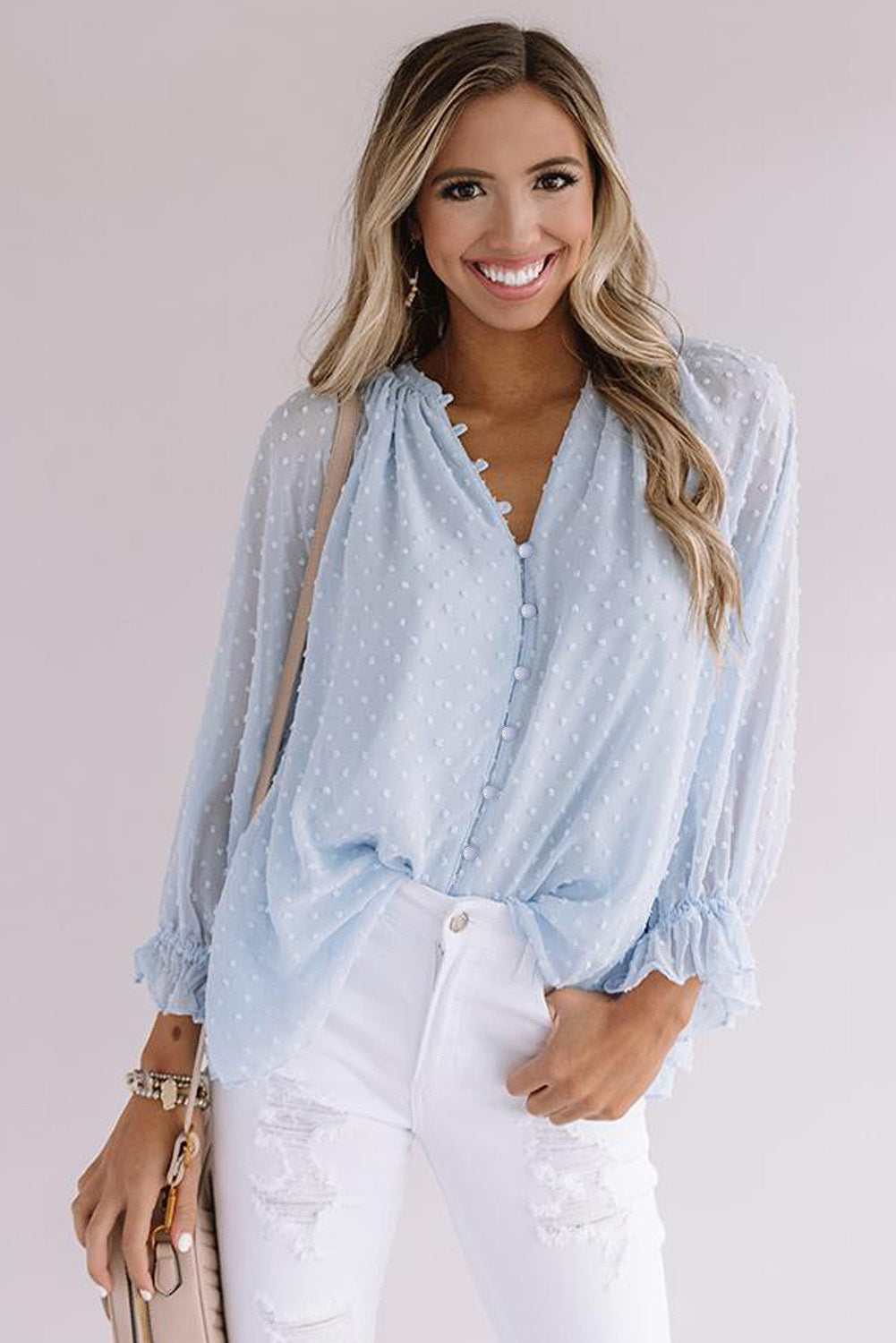 Chemise à pois suisses à boutons amples 