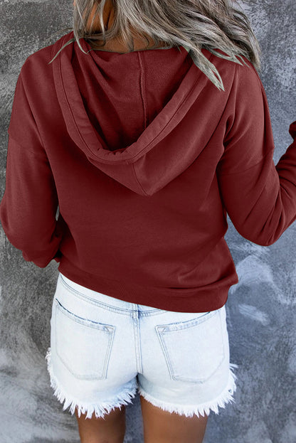 Sweat à capuche à boutons-pression avec poche