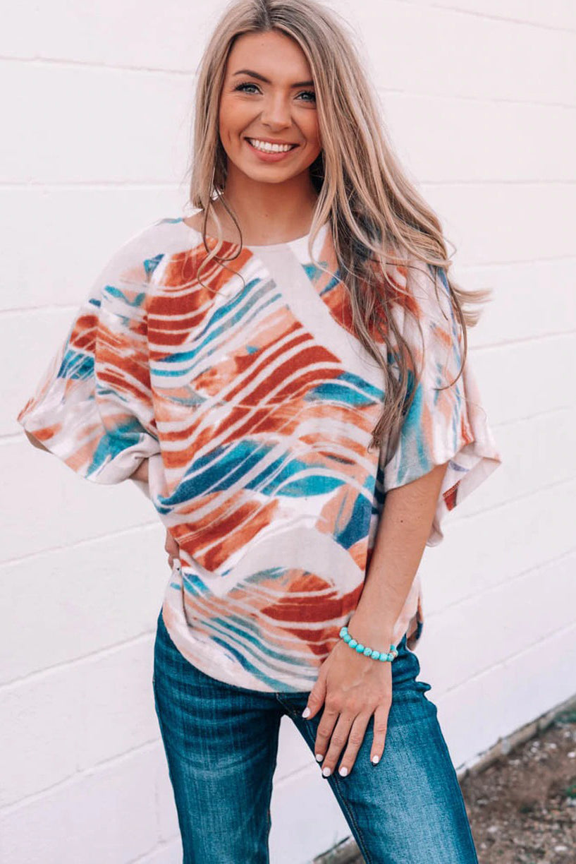 Top dolman fluido con estampado tie-dye