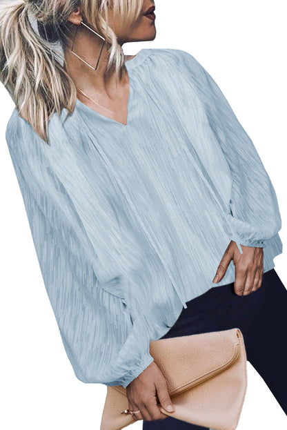 Haut uni texturé à col en V et manches lanternes 