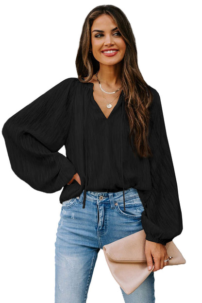 Haut uni texturé à col en V et manches lanternes 