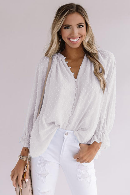 Chemise à pois suisses à boutons amples 