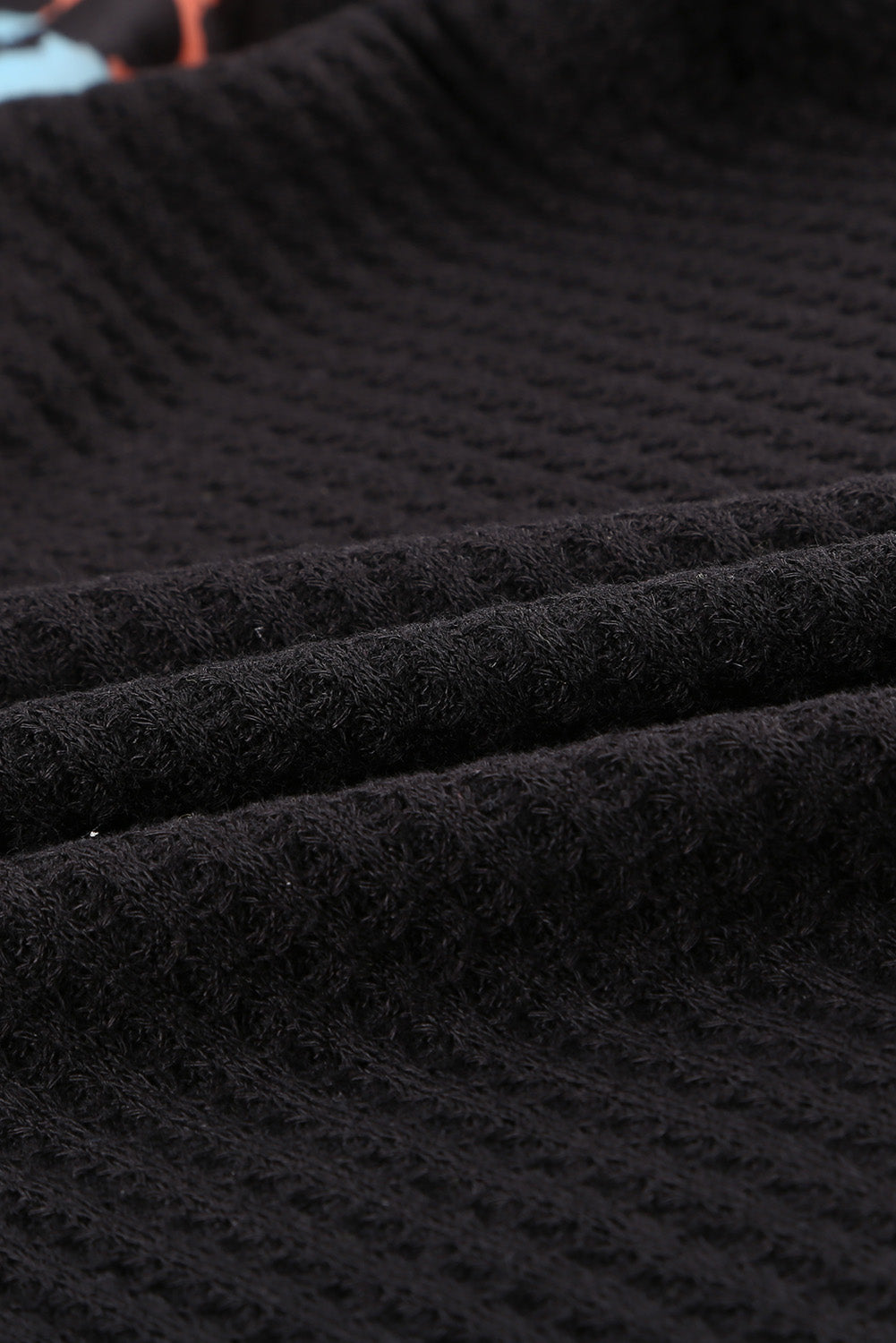 Top de punto con patchwork de leopardo colorblock