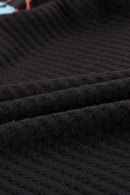 Top de punto con patchwork de leopardo colorblock