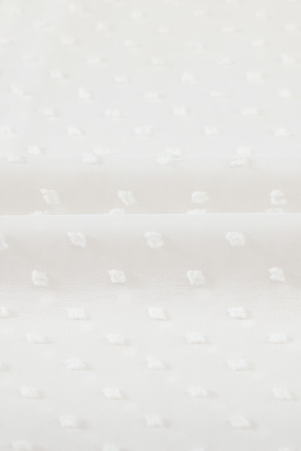 Camisa abotonada con volantes y lunares