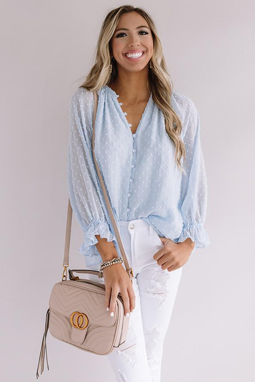 Chemise à pois suisses à boutons amples 