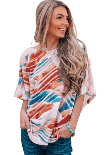 Top dolman fluido con estampado tie-dye